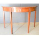 A 19th century mahogany demi lune table, 71cm by 106cm