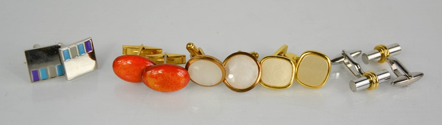 A group of vintage cufflinks.