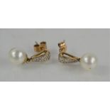 A pair of 9ct gold diamond and pearl drop earrings