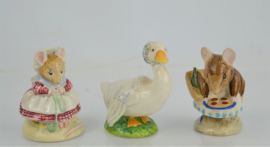 Three Beswick Beatrix Potter figures "The old Woman who lived in a Shoe Knitting" "Appley Dapply"