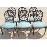 A set of six Hepplewhite style ebonised spider web back chairs