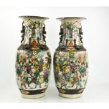 A pair of large Chinese stoneware glazed vases, modelled with dogs of fo, and painted with figural
