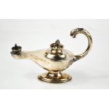 A silver table 'Genie' type oil lamp / table cigar lighter, with original stopper and inner liner,
