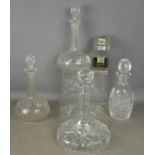 Four cut glass decanters of differing form.