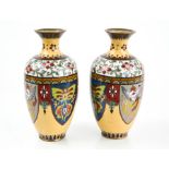 A pair of cloisonne enamel vases, circa 1900, decorated with shields depicting birds and