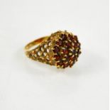 A 9ct gold and garnet cluster ring, size N, 7.4g.