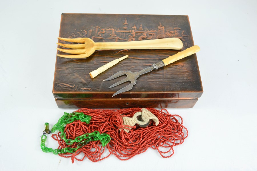 Two vintage necklaces; one jade example, two bone carved forks, pipe and a copper embossed box.