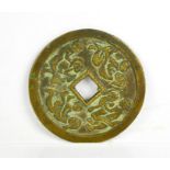 A Chinese bronze disc, with calligraphy to one side and erotica scenes the other. 6cms diameter