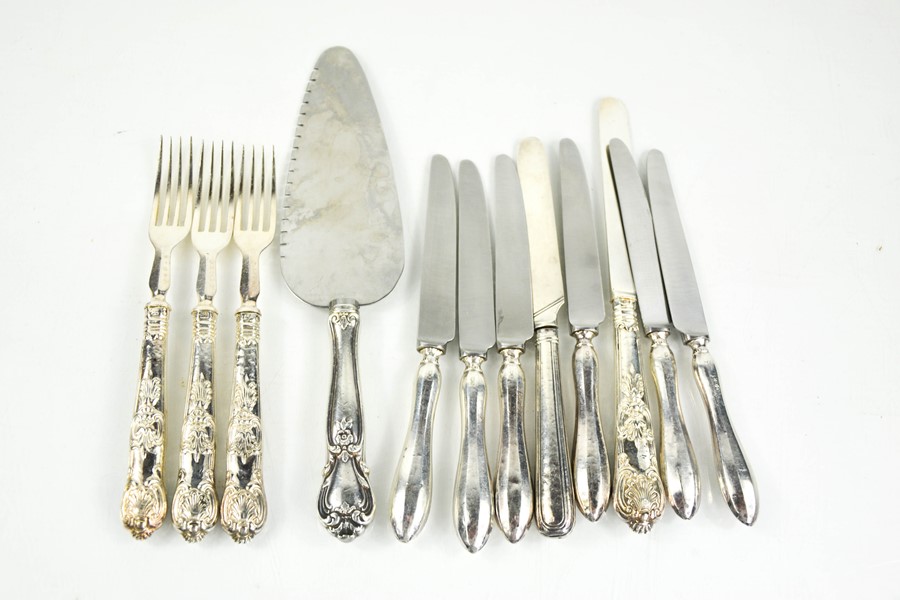 A set of six silver handled butter knives, part set of silver handled knives and forks, and a cake