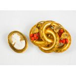 A Victorian pinchbeck and coral brooch, together with a gilt metal cameo brooch depicting