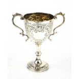 A silver trophy, embossed with scrollwork, Sheffield 1903, 3.85toz.