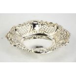 A silver bon bon dish, with with floral embossed decoration and pierced cartouche panels, London