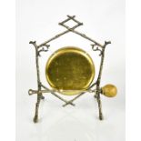 An early 20th century silver plated and brass table dinner gong, with a branch form frame, 25cm