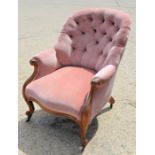 A Victorian button back armchair