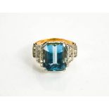 A gold, platinum, aquamarine and diamond ring, the rectangular cut aquamarine approximately 9cts,