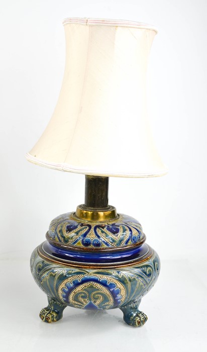 A 19th century Doulton table lamp by Edith Lupton (1875-1890), decorated in dark blue and raised