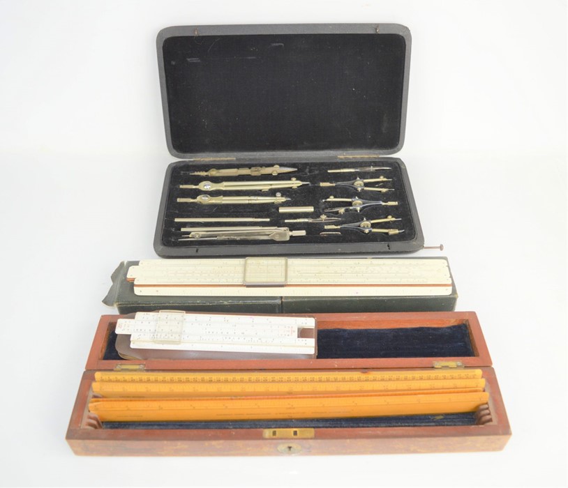 A part-cased set of Lee Guinness technical drawing instruments together with slide rulers, J. Halden