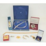 A group of jewellery to include silver Indian brooch and earring set, necklaces and other items.