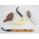 A Salzburg Tiroler carved smoking pipe bowl, ceramic Berta’s Errettung pipe and other items