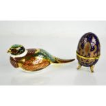 A Royal Crown Derby bird and a porcelain egg form trinket box.