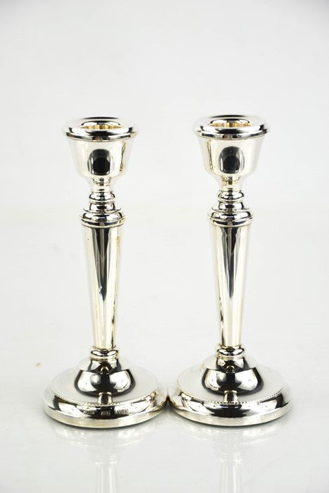 A pair of silver candlesticks, Birmingham 1979, with weighted bases.