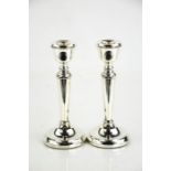 A pair of silver candlesticks, Birmingham 1979, with weighted bases.