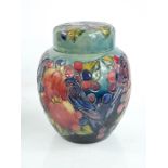 A William Moorcroft ginger jar and cover, decorated in the Finches pattern, 10ins high, stamped