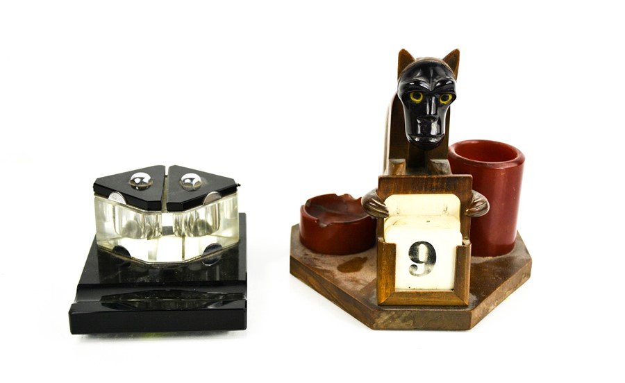 An Art Deco calendar clock in the form of a monkey, together with an inkwell.