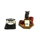 An Art Deco calendar clock in the form of a monkey, together with an inkwell.