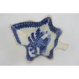 An early 19th century English blue and white Maple leaf form pottery dish depicting basket of