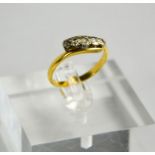 A yellow metal (tested as 9ct gold) and diamond five stone ring, size P, 3.29g.