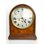 A 19th century mahogany domed mantle clock, with beaded edge, Roman numeral dial enclosed with
