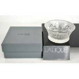 A Lalique glass bowl, embossed with tigers, with original box. 11.5cms diameter