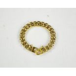 A 14ct gold (tested as) oval link bracelet with safety chain, 32.13g.