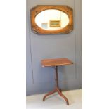 A 1930s oak mirror and an oak 19th century tripod table.