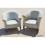 Two early 20th century tub chairs covered in a light blue fabric.