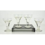 A set of four glasses, 19th century, 15cm high.