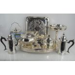 A group of silver plated items to include trays, coffee pot, cruet set and a Wedgwood biscuit barrel