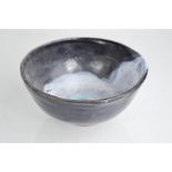 Catriona McLeod (born 1946): a small Studio pottery bowl, terracotta with blue and white glaze.