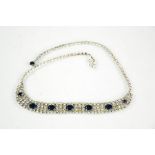A diamante dress necklace, in a diamond and sapphire style.
