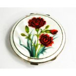 A silver and guilloche enamel compact, painted with red roses, mirrored interior, 3.1toz total.