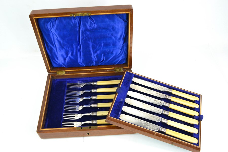 A set of silver and bone handled fish knives and forks, the silver blades and fork heads engraved