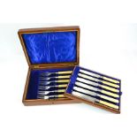 A set of silver and bone handled fish knives and forks, the silver blades and fork heads engraved