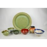 A group of studio pottery, to include two bowls by Nick Molotore, and a charger by CMS, 37cm