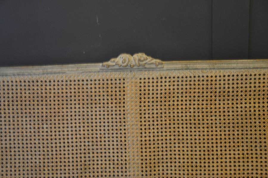 A French 19th century style settee, the caned back with floral carved back, shaped arms and - Image 2 of 3