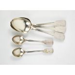 Three Georgian silver dessert spoons and two silver teaspoons London 1850, all engraved with the