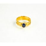 A yellow metal and sapphire ring with double band, inscribed inside, size Q/R, 5.75g.