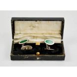 A pair of silver and green enamelled oval form cuff links, in presentation case.