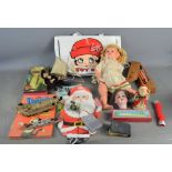 A group of vintage toys and dolls to include a Betty Boop bag, German bisque dolls head etc