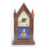 A 19th century Ansonia brass and copper company mantel clock in the form of a steeple, with roman